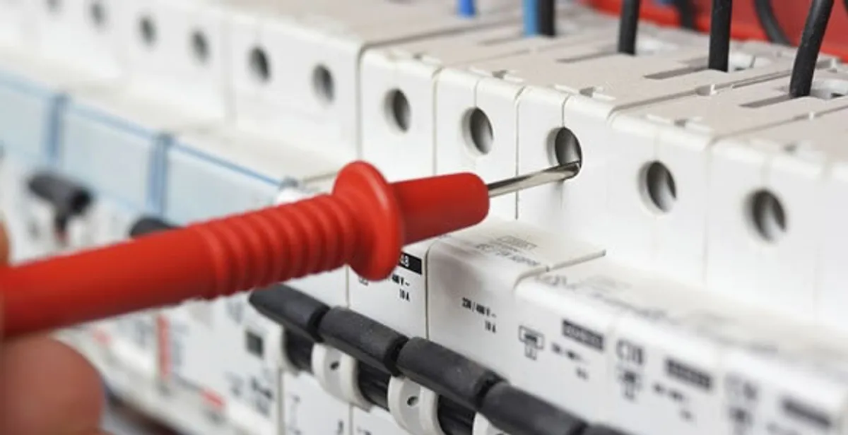 Electrical contractor testing circuit breakers during electrical repair in Walls, MS